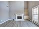 Light-filled living room featuring fireplace with marble surround and modern floors at 3634 Autumn Ridge Pkwy, Marietta, GA 30066