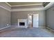 Spacious main bedroom features a fireplace, gray walls, carpet, and doorway that offers access to other rooms at 3634 Autumn Ridge Pkwy, Marietta, GA 30066