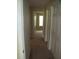 Neutral-colored hallway with linen closet and open view to a sunlit room at 959 Romer Pl, Stone Mountain, GA 30083