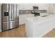 Kitchen featuring stainless steel appliances, a center island and white cabinetry at 1230 Firefly Field Trce, Lawrenceville, GA 30045
