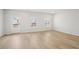Bright living room showcasing lovely floors, white walls and a door to the outside at 1230 Firefly Field Trce, Lawrenceville, GA 30045