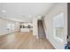 Open-concept living area boasts modern flooring, ample natural light, and a staircase at 1230 Firefly Field Trce, Lawrenceville, GA 30045