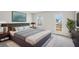 Inviting bedroom featuring a large window, an exterior door, and stylish furniture at 1230 Firefly Field Trce, Lawrenceville, GA 30045