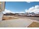 A street view of new construction homes showing new landscaping and a bright blue sky at 1230 Firefly Field Trce, Lawrenceville, GA 30045