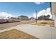A street view showcases the new construction community with sidewalks and young trees at 1230 Firefly Field Trce, Lawrenceville, GA 30045