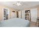 Bright bedroom with ceiling fan, closet, and connecting bathroom at 1101 Collier Nw Rd # V6, Atlanta, GA 30318