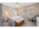 Comfortable bedroom filled with light, complemented by two windows and neutral walls at 1101 Collier Nw Rd # V6, Atlanta, GA 30318