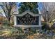 The Carlyle Square condominium community sign surrounded by plants and shrubbery at 1101 Collier Nw Rd # V6, Atlanta, GA 30318