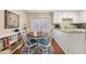 Bright dining area with a round table, white chairs, and a view to the outside at 1101 Collier Nw Rd # V6, Atlanta, GA 30318