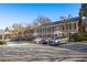 Traditional brick townhome with black shutters and well-maintained landscaping at 1101 Collier Nw Rd # V6, Atlanta, GA 30318