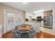 Inviting kitchen featuring stainless steel appliances and a breakfast nook area at 1101 Collier Nw Rd # V6, Atlanta, GA 30318