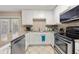 Modern kitchen with granite countertops and stainless steel appliances at 1101 Collier Nw Rd # V6, Atlanta, GA 30318