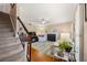 Bright living room with fireplace, plush seating, and stairs to the next level at 1101 Collier Nw Rd # V6, Atlanta, GA 30318