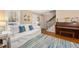 Inviting living room with comfortable seating, a piano and a beachy decor at 1101 Collier Nw Rd # V6, Atlanta, GA 30318