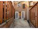 Narrow patio with brick fence and an entrance to the house at 1101 Collier Nw Rd # V6, Atlanta, GA 30318