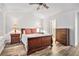 Bedroom featuring wood-look floors, neutral walls, and ceiling fan at 113 Ambridge Ct, Lawrenceville, GA 30044