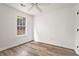 This bedroom features a ceiling fan and natural light at 113 Ambridge Ct, Lawrenceville, GA 30044