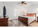 Bedroom with a ceiling fan, window with blinds, and wood-look flooring at 113 Ambridge Ct, Lawrenceville, GA 30044