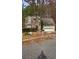Traditional two-story home with a two-car garage and front yard with a tree at 113 Ambridge Ct, Lawrenceville, GA 30044