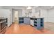 Functional kitchen with stainless steel appliances and blue cabinetry at 113 Ambridge Ct, Lawrenceville, GA 30044
