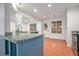 Well-lit kitchen featuring granite countertops and a breakfast bar at 113 Ambridge Ct, Lawrenceville, GA 30044