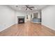 Bright living room with hardwood floors, a fireplace, and an open layout at 113 Ambridge Ct, Lawrenceville, GA 30044