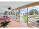 Covered back porch with seating area and view of backyard at 4932 Chisel Way, Duluth, GA 30096