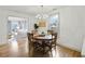 Bright dining room with hardwood floors and view of living room at 4932 Chisel Way, Duluth, GA 30096