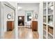 Inviting hallway with built-in shelving and a fireplace at 4932 Chisel Way, Duluth, GA 30096