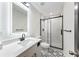 Modern bathroom with a sleek vanity, elegant tile and walk-in shower at 1147 Graymont Sw Dr, Atlanta, GA 30310