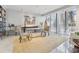 Bright living room featuring large windows, a glass table, and a built in bookshelf at 147 15Th Ne St # 10C, Atlanta, GA 30309