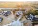 Aerial view displays the property nestled on a well-maintained lot surrounded by lush greenery in a neighborhood at 907 Hannah Ct, Loganville, GA 30052