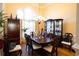 Spacious dining area boasts a formal dining set, elegant chandelier, and ample natural light at 907 Hannah Ct, Loganville, GA 30052