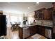 Spacious kitchen with breakfast area, wood cabinets, granite countertops, and stainless steel appliances at 907 Hannah Ct, Loganville, GA 30052