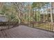 Back porch with wooden railings overlooking a private backyard at 1896 Wee Kirk Se Rd, Atlanta, GA 30316