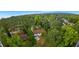 An aerial view of a tree filled property with a one-story home at 3293 Valleydale Sw Dr, Atlanta, GA 30311
