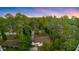Aerial shot showcasing a cozy home tucked away in a serene setting of lush trees at 3293 Valleydale Sw Dr, Atlanta, GA 30311