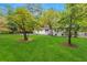 A well-manicured lawn with mature trees surrounds a charming, renovated home at 3293 Valleydale Sw Dr, Atlanta, GA 30311