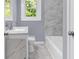 Bathroom with a soaking tub and a white vanity and view of the outdoor at 3293 Valleydale Sw Dr, Atlanta, GA 30311