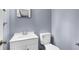 Bathroom featuring a white vanity with sink and a matching white toilet at 3293 Valleydale Sw Dr, Atlanta, GA 30311