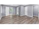 Spacious bedroom featuring new floors and neutral paint with multiple entryways at 3293 Valleydale Sw Dr, Atlanta, GA 30311