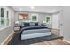 Cozy bedroom with two windows, stylish furniture, and neutral tones, offering a relaxing retreat at 3293 Valleydale Sw Dr, Atlanta, GA 30311