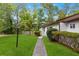 Charming single story home featuring mature landscaping and a well-manicured lawn at 3293 Valleydale Sw Dr, Atlanta, GA 30311