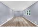 Bright and spacious living room filled with natural light and featuring modern wood-look floors at 3293 Valleydale Sw Dr, Atlanta, GA 30311