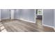 Open-concept living area, seamlessly blending into the kitchen, with stylish wood-look floors at 3293 Valleydale Sw Dr, Atlanta, GA 30311