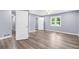 Large main bedroom featuring neutral paint and new wood-look floors at 3293 Valleydale Sw Dr, Atlanta, GA 30311