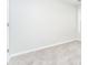 Simple bedroom with neutral walls and carpeted flooring at 7077 Ravenwood Ln, Lithonia, GA 30038