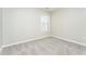 Bright bedroom with neutral walls and carpeted flooring at 7077 Ravenwood Ln, Lithonia, GA 30038