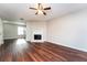 Living room with fireplace and wood-look flooring at 7077 Ravenwood Ln, Lithonia, GA 30038