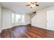 Spacious living room with bay window and hardwood floors at 7077 Ravenwood Ln, Lithonia, GA 30038